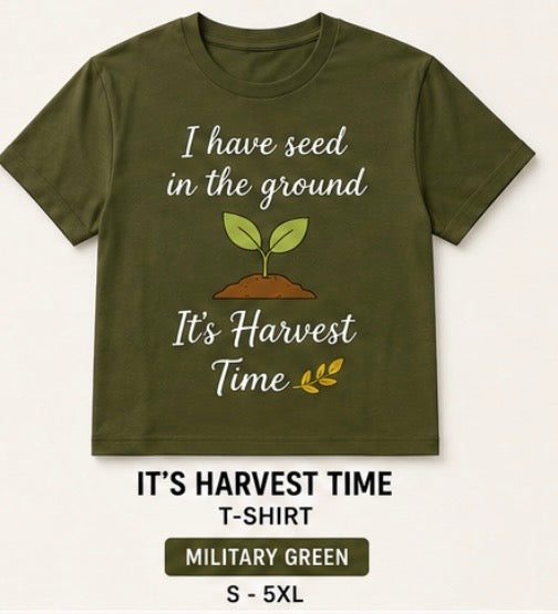 An olive green crewneck t-shirt with a graphic that reads 'I have seed in the ground' and 'It's Harvest Time' around a small sprout illustration. Below the shirt, text reads 'IT'S HARVEST TIME T-SHIRT', 'MILITARY GREEN', and 'S - 5XL'.